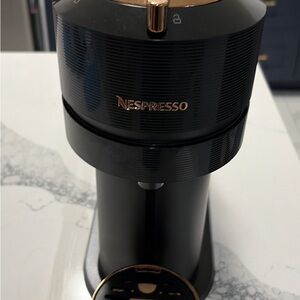 Nespresso Black and Gold Coffee Maker